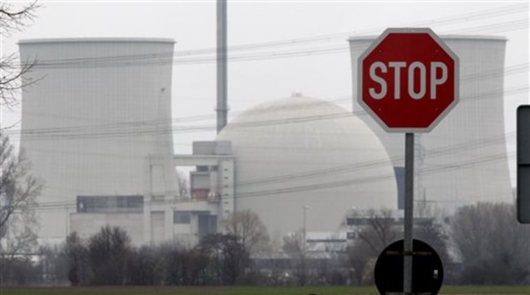 FILE - In this March 18, 2011 file photo, a traffic sign stands next to the nuclear power plant of Biblis, Germany. Germany stands alone among the world's leading industrialized nations in its determination to abandon nuclear energy for good because of the technology's inherent risk. Europe's biggest economy is betting billions on expanding the use of renewable energies to meet its demand instead. The transition was supposed to happen slowly over the next 25 years, but now it is being accelerated in the wake of Japan's Fukushima disaster. Chancellor Angela Merkel said the "catastrophe of apocalyptic dimensions" irreversibly marks the start of a new era. (AP Photo/Michael Probst,File)